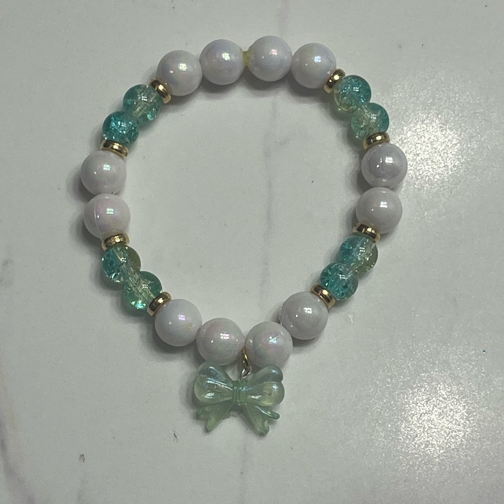 White and Teal Beaded Bracelet with Bow Charm